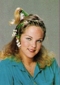 Melissa Sue Anderson with green decorations in her hair for the holidays